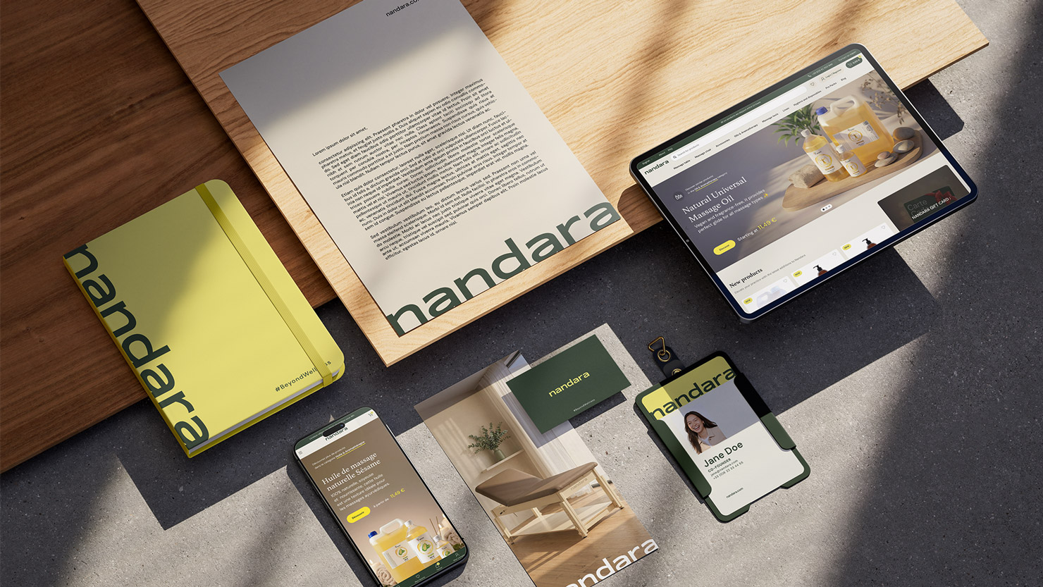 Nandara notebook, letterhead, badge and digital screens